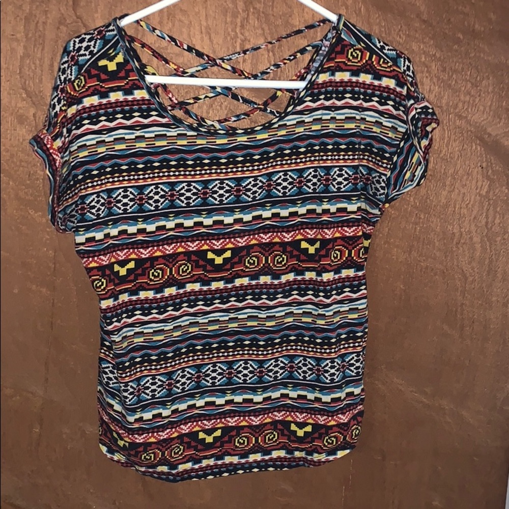 Cute top with cross cross detailing on back!